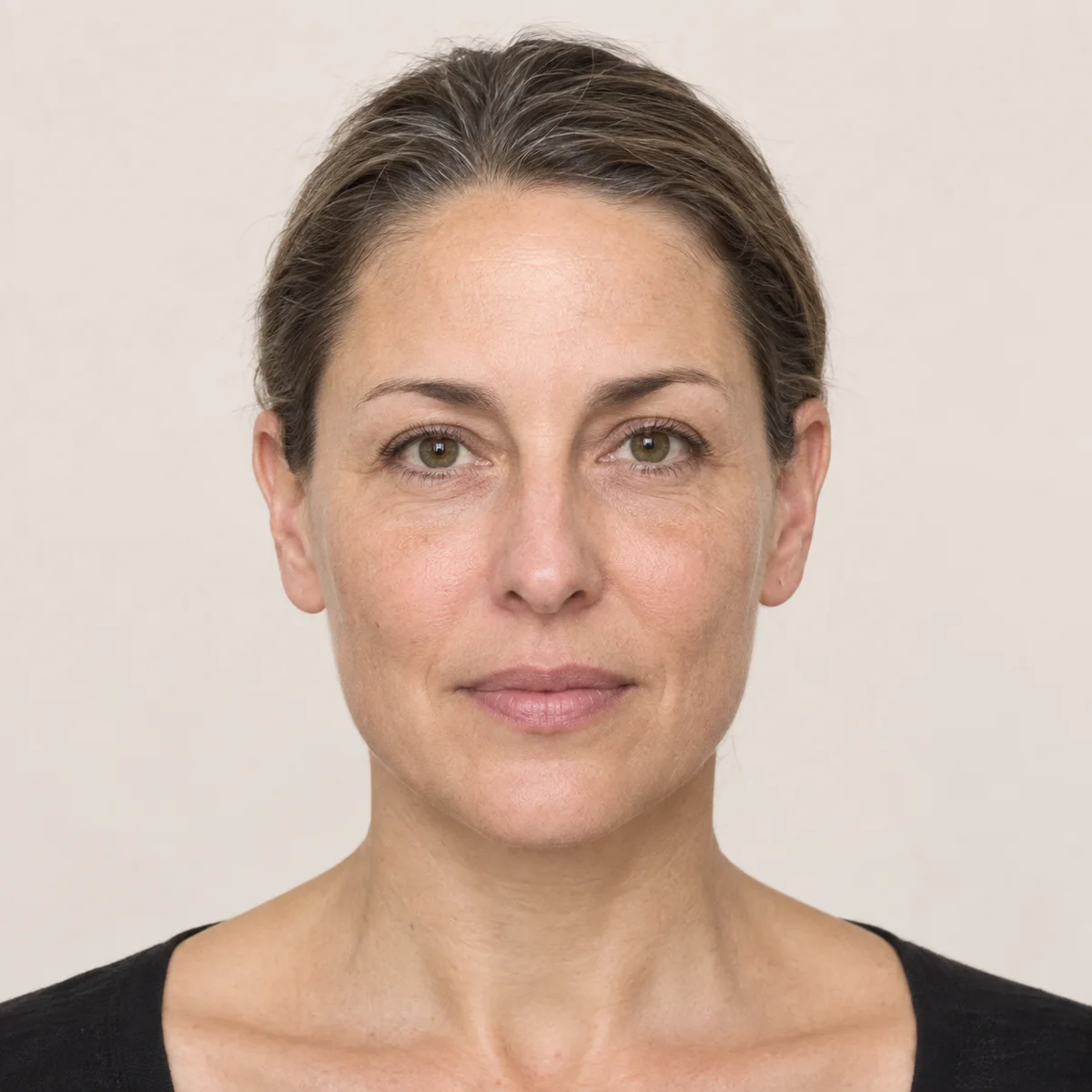 Illustrative frontal portrait showing facial balance reference points